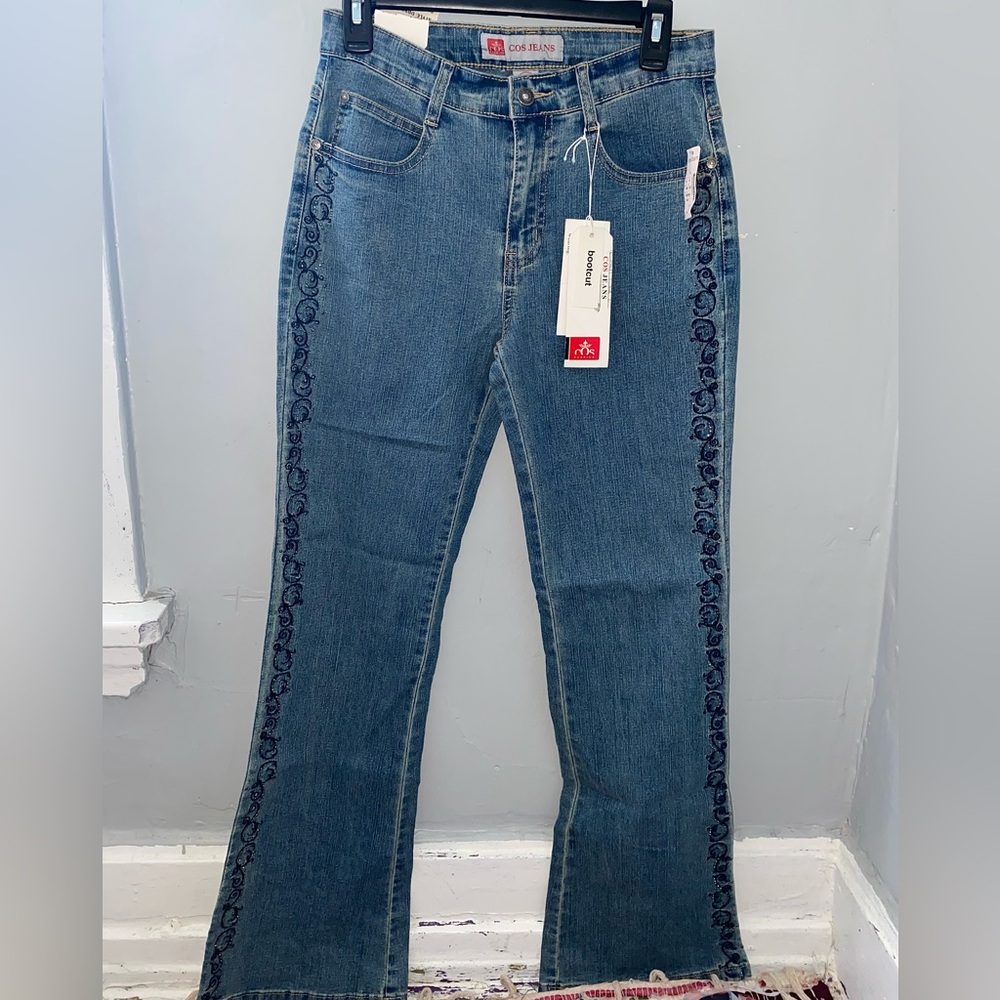 COS blue and navy flared jeans with embroidery on the side